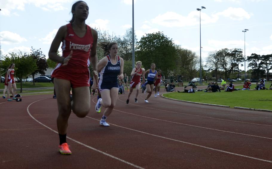 Track athletes compete in the 800-meter run during the opening track and field meet of the season at RAF Lakenheath, England, Saturday, April 15, 2017.