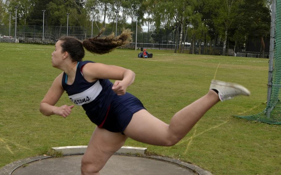 Bitburg's Elise Rasmussen throws a discus just more than 100 feet during the opening track and field meet of the season at RAF Lakenheath, England, Saturday, April 15, 2017.