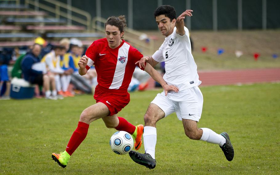 International School of Brussels' Giorgio Ceriani Sebregond, left, tries to get the ball before Ramstein's Gerald Donohue at Ramstein Air Base, Germany, on Friday, April 28, 2017. ISB lost the game 1-0.