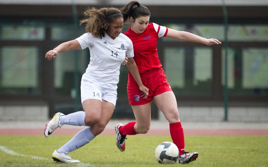 International School of Brussels' Julianna Hilliard, right, battles Ramstein's Haley Deome for the ball at Ramstein Air Base, Germany, on Friday, April 28, 2017. ISB lost the game 4-1.