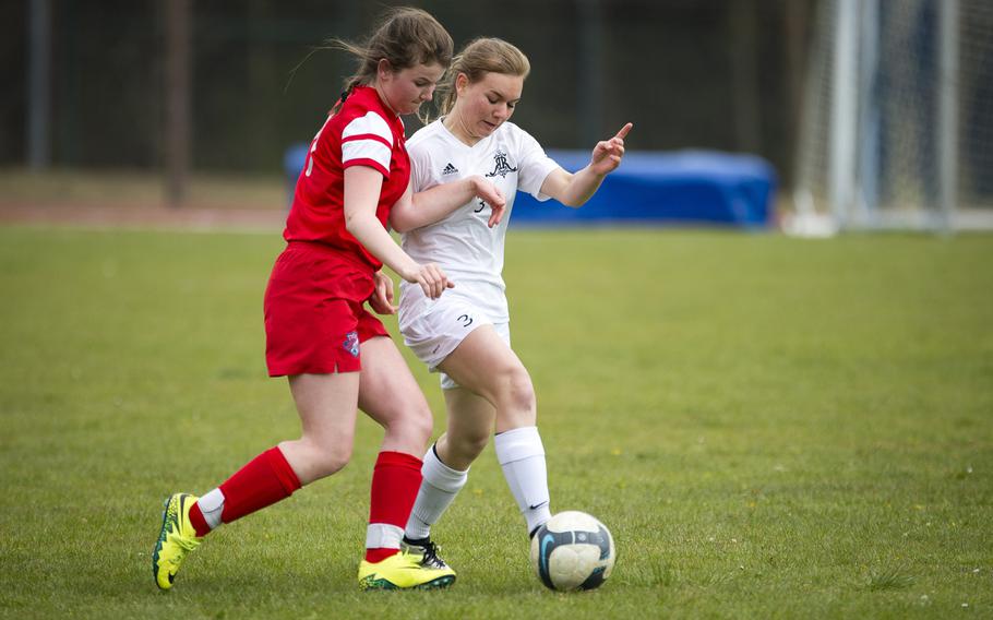 Ramstein's Liesel Mendenhall, right, and International School of Brussels' Amelie van den Akker race for the ball at Ramstein Air Base, Germany, on Friday, April 28, 2017. Ramstein won the game 4-1.