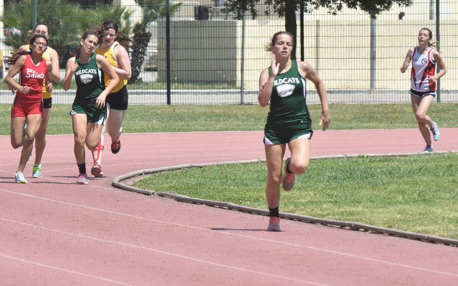 Naples' Claire Elliott, 15, keeps a commanding lead in a victory in the 800-meter race during a track meet at the Navy Support Site in Gricignano, Italy on Saturday, April 29, 2017. 
