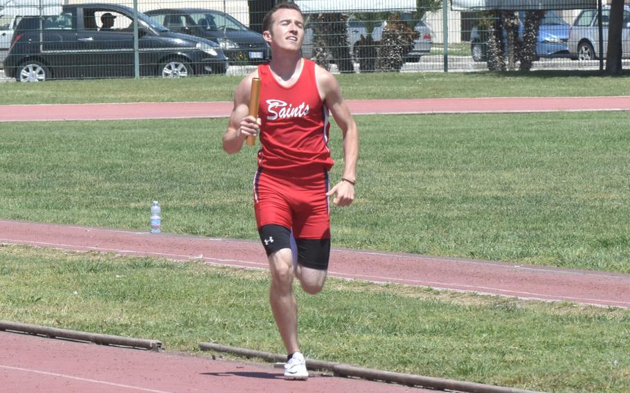 Aviano's Austin Groves, 18, runs the 800-meter anchor on the sprint medley, helping his team win during a track meet at the Navy Support Site in Gricignano, Italy on Saturday, April 29, 2017. 
