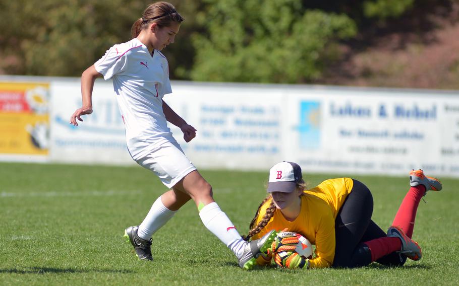 ISB's Jessica Sliter gets to the ball before Kaiserslautern's Aleysha Myers n a Division I game at the DODEA-Europe soccer championships in Reichenbach, Germany. Kaiserslautern won 2-0.

