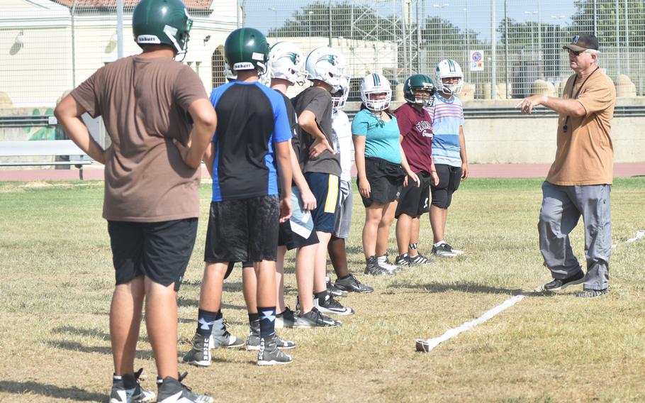Naples offensive line coach Ken Williams talks to players at practice Thursday Aug. 31, 2017 at the high school. The Wildcats are rebuilding after losing most of last year's seasoned seniors. 