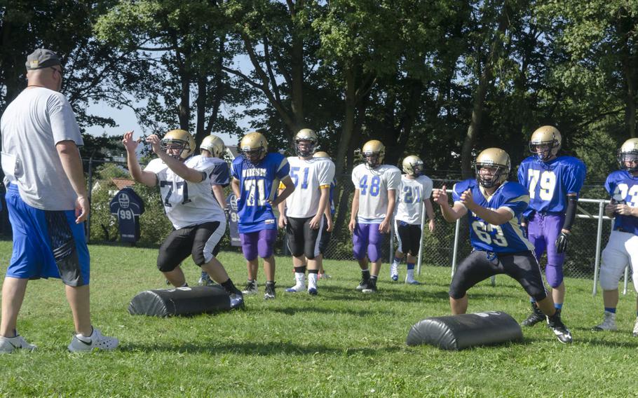 Linemen with the Wiesbaden football team go through drills at a preseason practice session in Wiesbaden, Germany, Tuesday, Aug. 29, 2017. Wiesbaden finished runners-up last season, losing 13-8 to Ramstein in the DODEA-Europe Division I championship game.