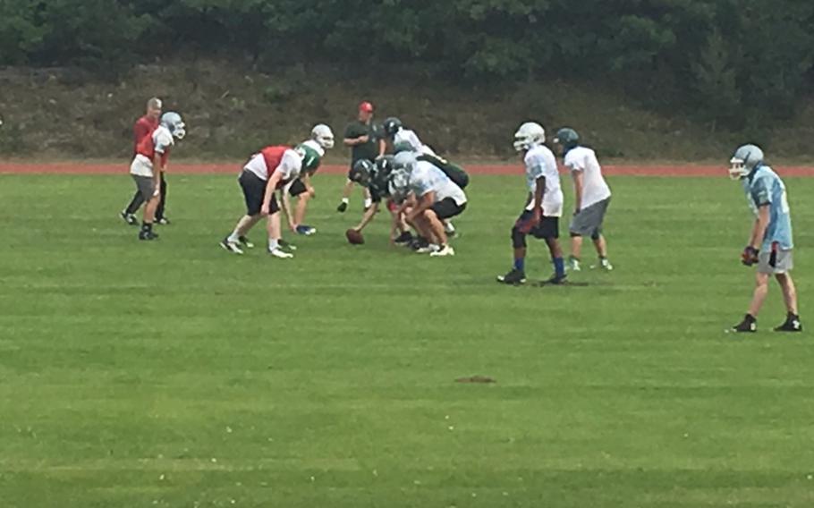 Members of the combined AFNORTH/Brussels football team practice while getting set for their first game of the season against Aviano.