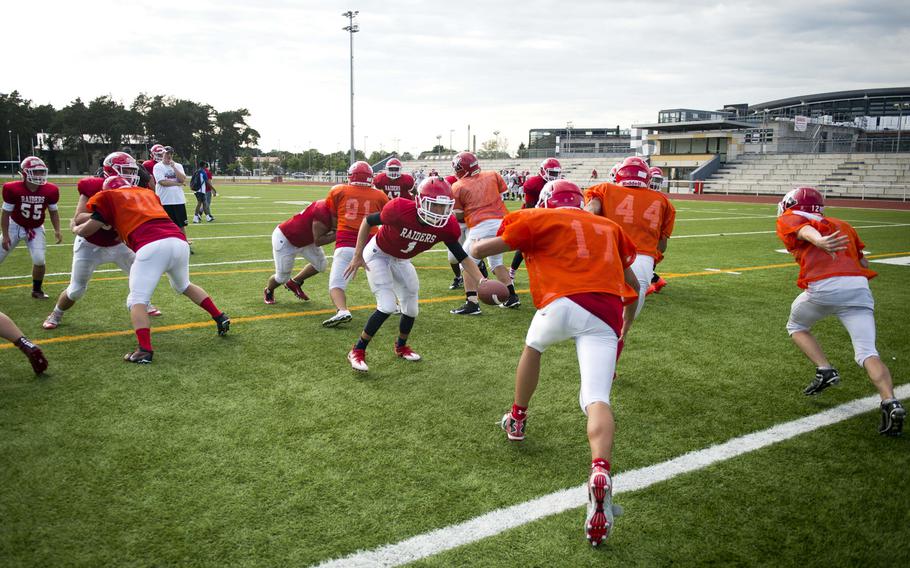 The Kaiserslautern Raiders run offensive plays during practice at Vogelweh, Germany, on Thursday, Aug. 24, 2017.