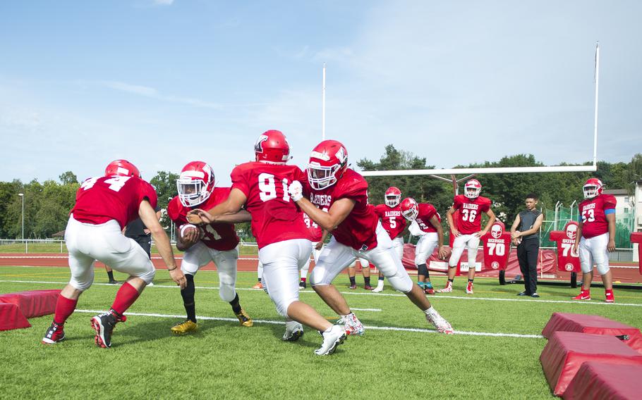 The Kaiserslautern football team practices tackling and blocking at Vogelweh, Germany, on Thursday, Aug. 24, 2017.