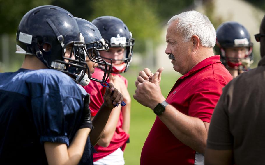 Mike Laue, Spangdahlem's head football coach, talks with his players during practice at Spangdahlem Air Force Base, Germany, on Thursday, Aug. 31, 2017.