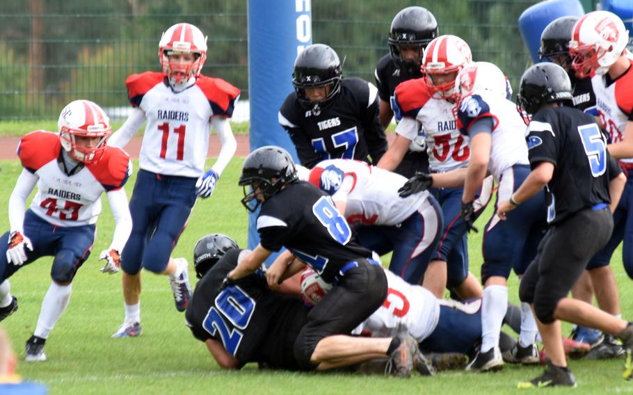 Hohenfels Tigers' running back Jean Morales crashes into the end zone on a two-point conversion during a game against the Brussels Raiders, at Hohenfels, Germany, Saturday, Sept. 16, 2017.