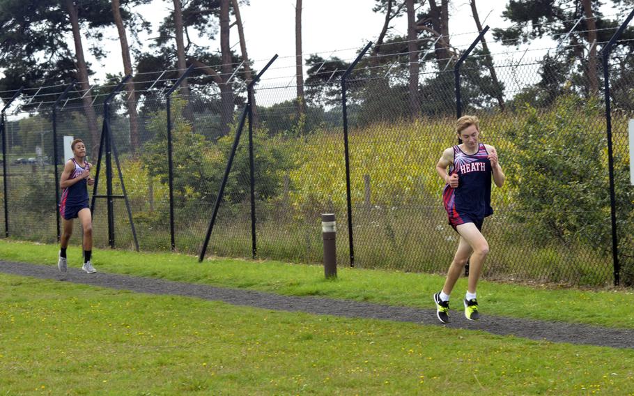 Lancer varsity boys cross country runner Patrick Arnold tries to catch up to his teammate Freedom Tansley during a meet against Alconbury at RAF Lakenheath, England, Saturday, September 23, 2017.