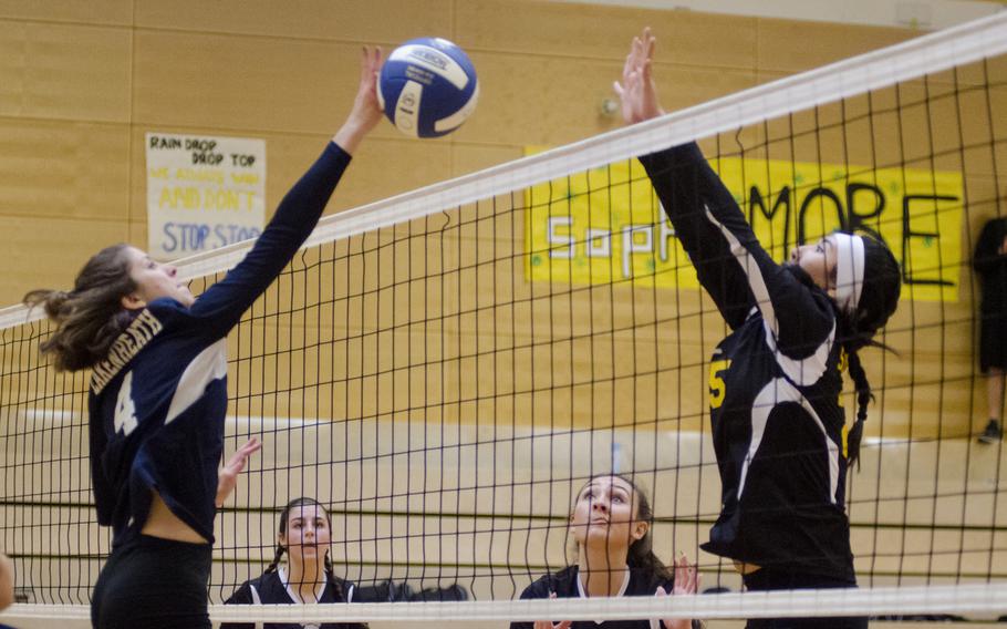 Lakenheath's Hannah Fonville, left, battles with Stuttgart's Karen Kosinski at the net in a match in Wiesbaden, Germany, Saturday, Oct. 14, 2017. Lakenheath upset last year's defending champions in four sets.