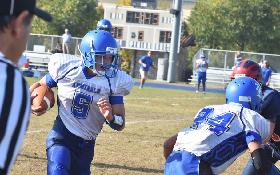 Rota's James Penta tries to use the block of teammate Brennon Colvin to gain yards Saturday in the Admirals' 33-30 loss to the Saints.
