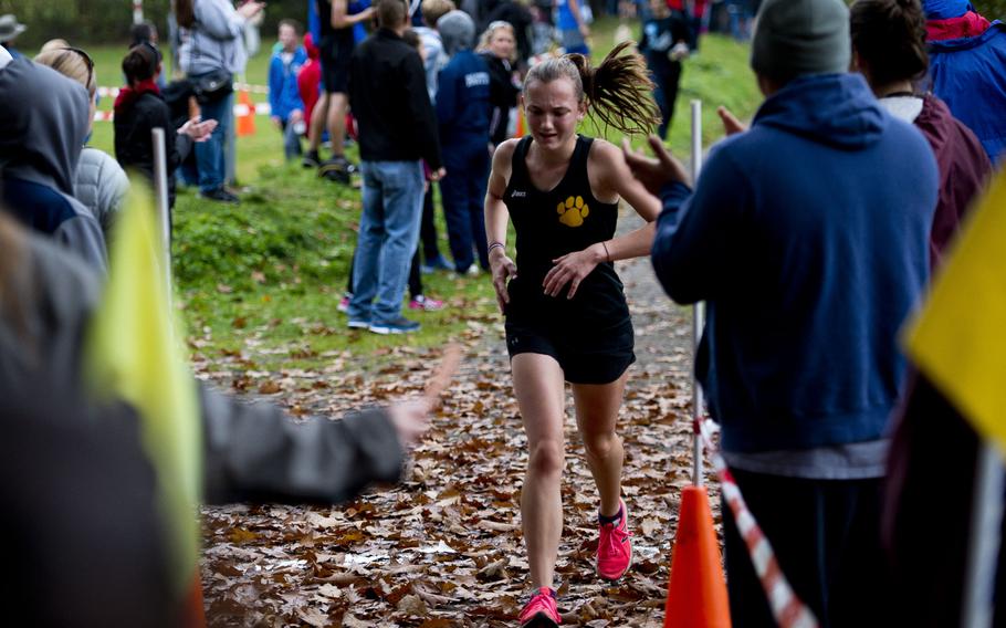 Stuttgart's Alycia Smith crosses the finish line at 21:13 for third place during a cross country meet in Ramstein-Miesenbach, Germany, on Saturday, Oct. 21, 2017. 
