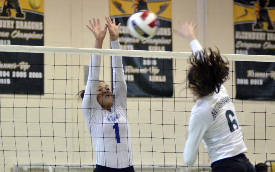 Brussels' Evin Harper tries to block against Alconbury’s Natalie Hayosh during a varsity volleyball game at RAF Alconbury, England, Saturday, Oct. 21, 2017. The Dragons defeated Brussels 26-24, 18-25, 11-25, 25-20, 15-11. 
