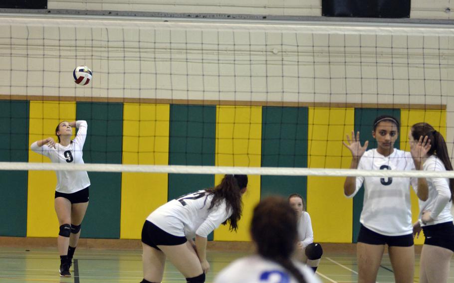 Alconbury’s Laela Evans serves against Brussels during a varsity volleyball game at RAF Alconbury, England, Saturday, Oct. 21, 2017. Evans led her team to victory with one ace, seven kills, eight digs and five assists. 