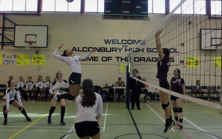 Brussels' Evin Harper leaps for a volleyball spike during a varsity game against AFNORTH at RAF Alconbury, England, Saturday, Oct. 21, 2017. Brussels beat the Lions but then lost a close game to the Dragons. 