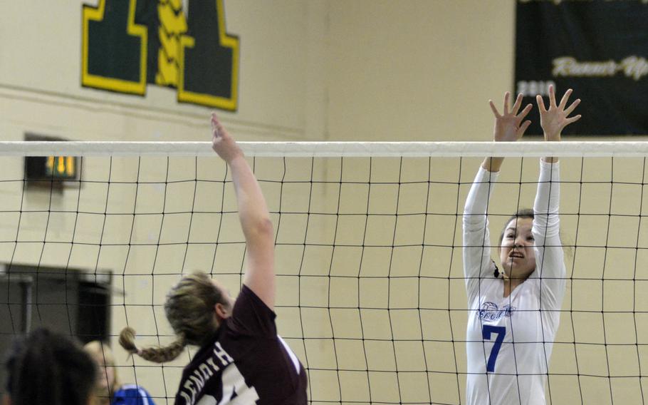 Brussels player Jewels Friedhoff looks to block a spike by AFNORTH’s Josie Bosch during a varsity volleyball game at RAF Alconbury, England, Saturday, Oct. 21, 2017. She had six kills and two blocks in the Brussels victory. 