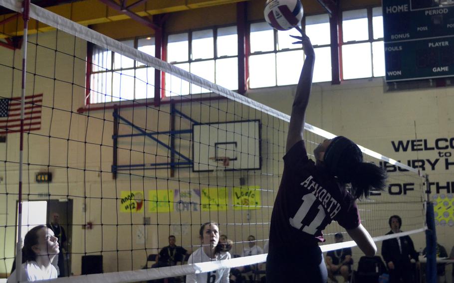 AFNORTH's Milahni Wilkerson tips the volleyball over the net during a set versus the Dragons at RAF Alconbury, England, Saturday, Oct. 21, 2017. She contributed nine kills and eight blocks in the AFNORTH win against Alconbury. 