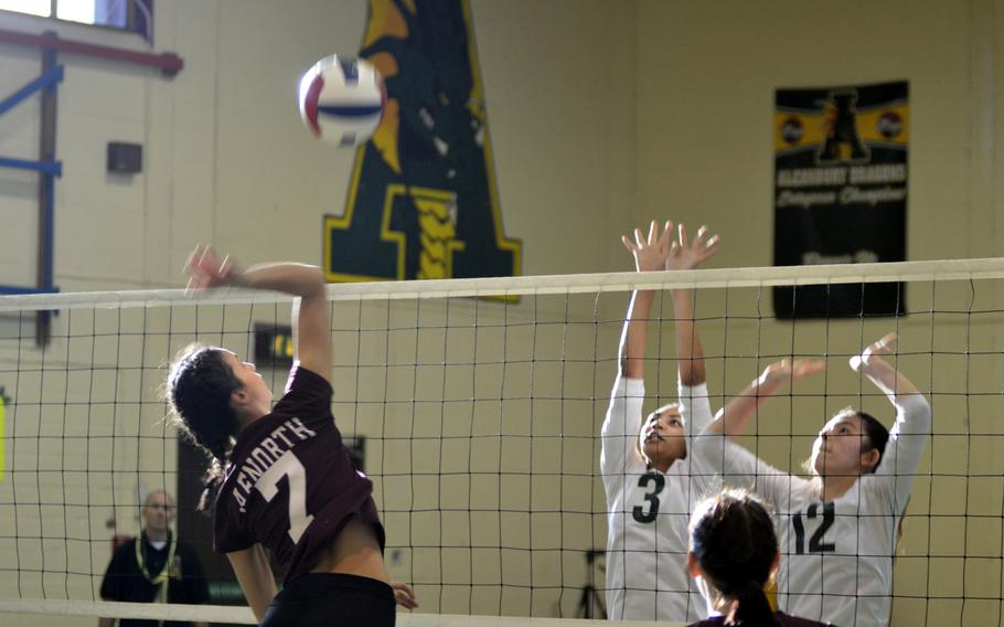 AFNORTH volleyball player Abia Gage spikes against Alconbury’s Kira Thorne and Anna Downing during a high school game at RAF Alconbury, England, Saturday, Oct. 21, 2017. The Lions defeated Alconbury, but lost their next game against Brussels. 