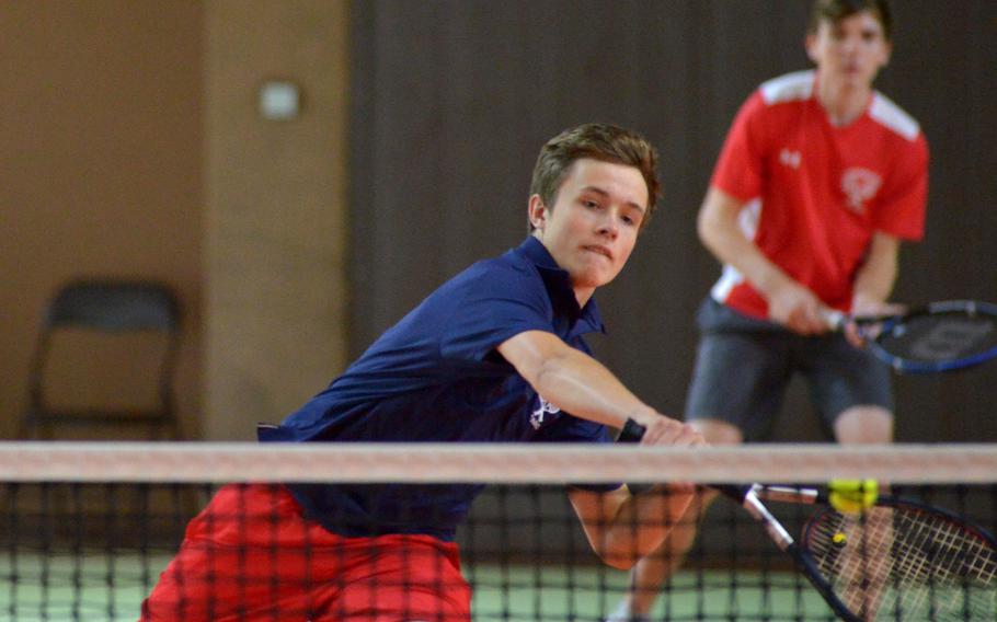 Lakenheath's Joseph Rowberry makes a return at the net as teammate Warren Vause watches in the background. The pair defeated Vicenza's Connor Wilson and Nicholas Tipton 6-3, 4-6, 10-8 at the DODEA-Europe tennis championships in Wiesbaden, Germany, Thursday, Oct. 26, 2017. 