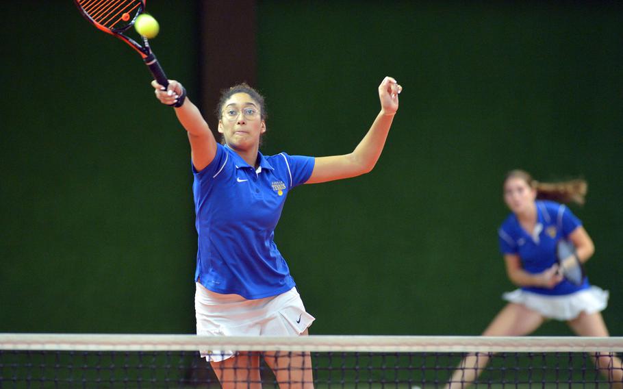 Wiesbaden's Melissa Pritchett leaps to return a shot in a girls double match against Kaiserslautern as teammate Shelby Albers watches. The pair defeated Josephine Little and Margaret Cayce 6-0, 6-1 at the DODEA-Europe tennis championships in Wiesbaden, Germany, Thursday, Oct. 26, 2017. 

