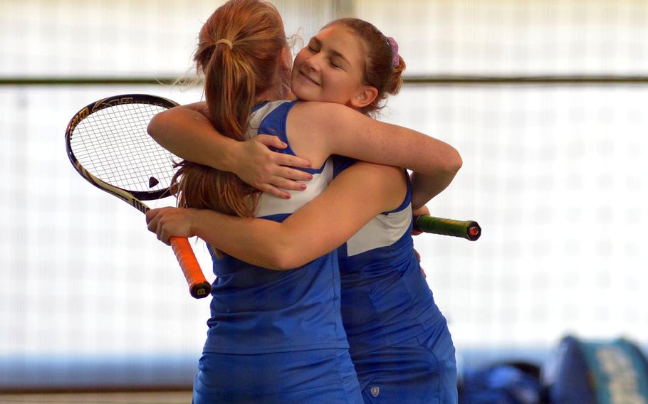Ramstein's Amanda Daly, right, hugs teammate Megan Stretch after beating SHAPE's Nikola Janigova and Maria Rebream 6-0, 6-2 to advance to Saturday's doubles final at the DODEA-Europe tennis championships in Wiesbaden, Germany, Friday, Oct. 27, 2017. 

