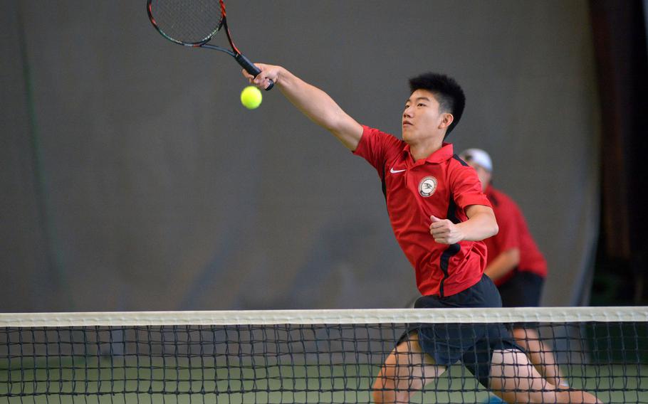 American Overseas School of Rome's William Hsia slams the ball over the net for a point in a doubles semifinal match at the DODEA-Europe tennis finals in Wiesbaden, Germany, Friday, Oct. 27, 2017. Hsia and teammate Federico Sarti beat Stuttgart's Bradley Roxbury and Bradley Russell 6-1, 6-0 to advance to Saturday's final

