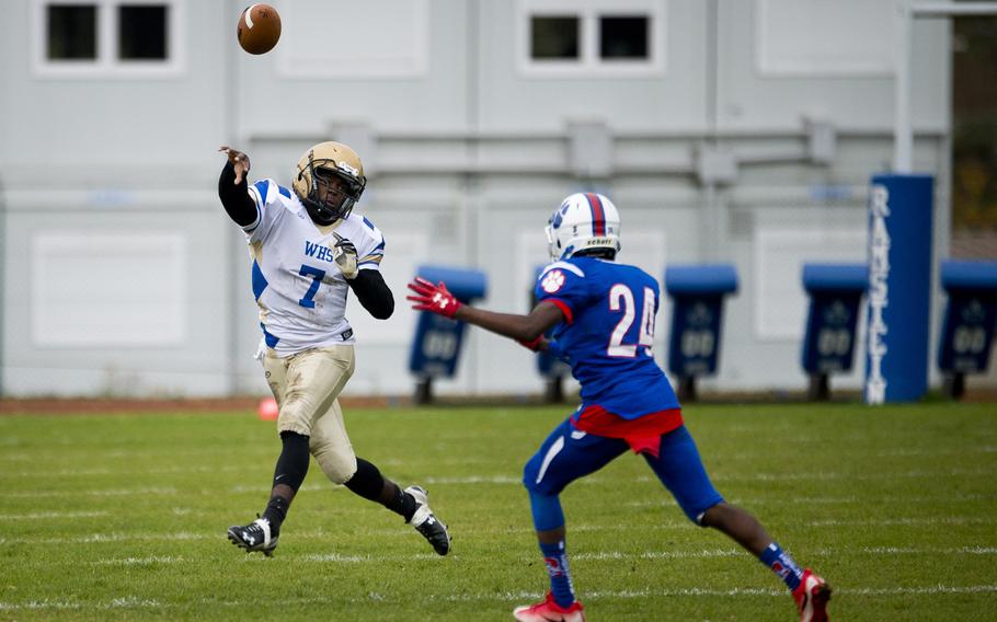 Wiesbaden's Josh Blake throws a pass over Ramstein's Cameron Chester during the DODEA-Europe Division I semifinal at Ramstein Air Base, Germany, on Saturday, Oct. 28, 2017.