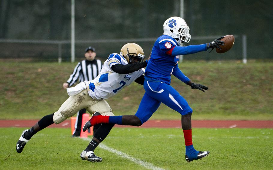Ramstein's Jorden Garland, right, runs into the end zone ahead of Wiesbaden's Josh Blake for a touchdown during the DODEA-Europe Division I semifinal at Ramstein Air Base, Germany, on Saturday, Oct. 28, 2017.