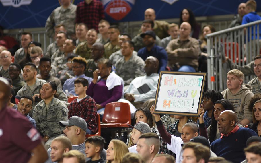 A young fan holds up a message on Friday, Nov, 10, 2017, to the televised audience tuning into the Armed Forces Classic at Ramtein Ari Base, Germany. Texas A&M beat West Virginia in the game.


