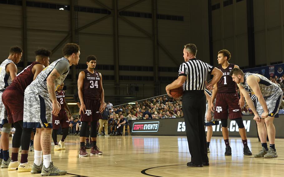 Players from Texas A&M and West Virginia wait for the ball during the Armed Forces Classic on Friday, Nov. 10, 2017, at Ramstein Air Base, Germany. 
