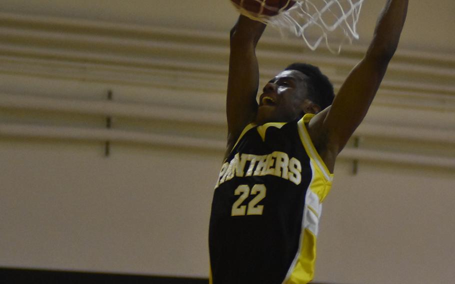 Stuttgart's Ahmad Johnson slams the ball through the net in the Panthers' 53-52 victory over Vicenza on Friday.