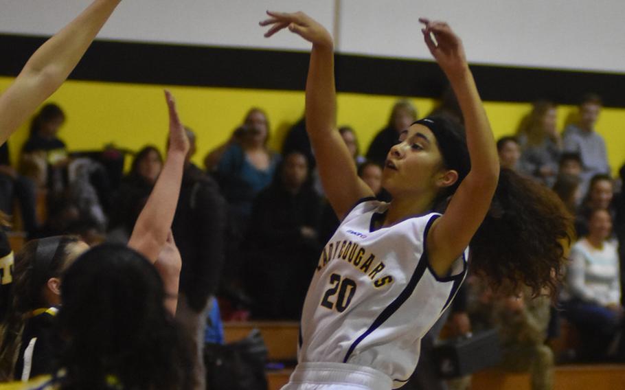 Vicenza's Amy Silbaugh puts up an off-balance shot in the Cougars' 42-16 loss to Stuttgart on Friday.