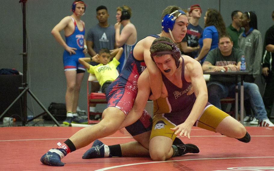 Baumholder's Ben Brinkmeyer, right, tries to get out of a hold by Lakenheath's Nick Scifo during a match at Vogelweh, Germany, on Saturday, Dec. 9, 2017.