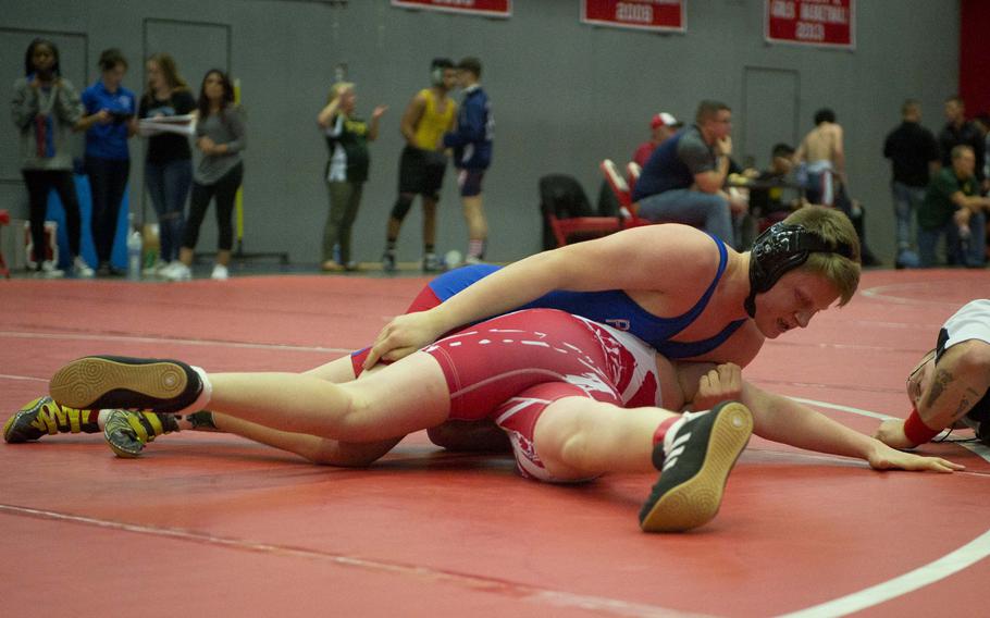 Ramstein's Benjamin Paddock turns Lakenheath's Brenden Kealoha for a pin during a match at Vogelweh, Germany, on Saturday, Dec. 9, 2017.