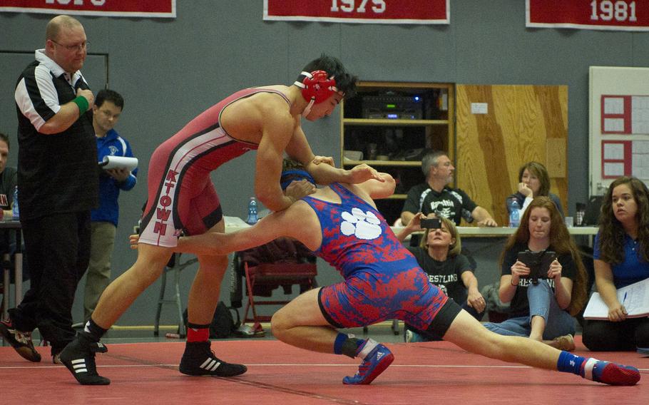 Kaiserslautern's Andrew Wells, left, blocks a maneuver by Ramstein's Nathan Kranz during a match at Vogelweh, Germany, on Saturday, Dec. 9, 2017.