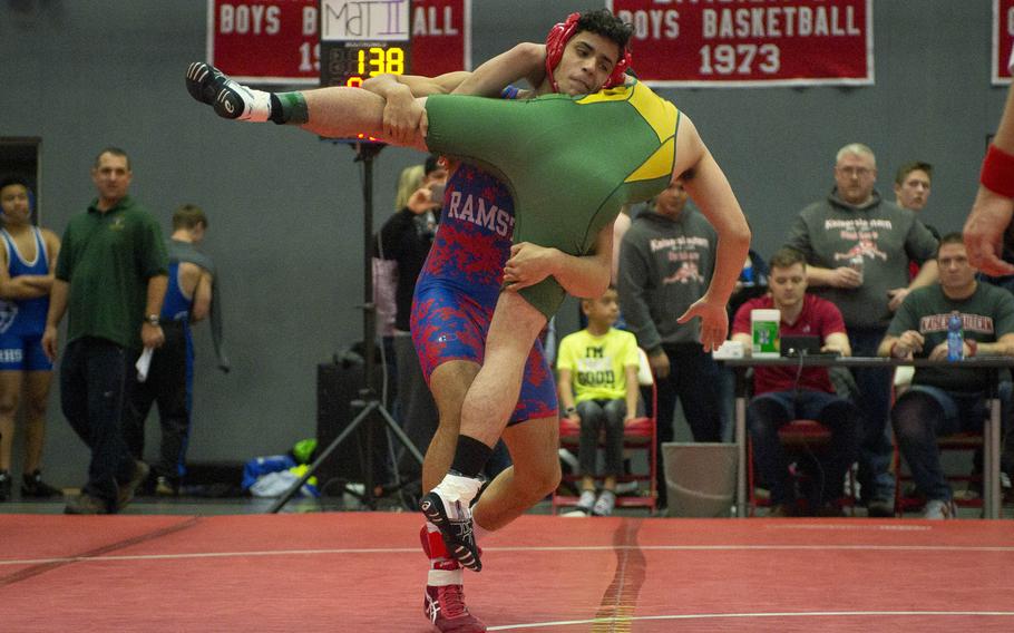 Ramstein's Bryce Thomas, left, flips SHAPE's Jacob Ripley during a match at Vogelweh, Germany, on Saturday, Dec. 9, 2017.