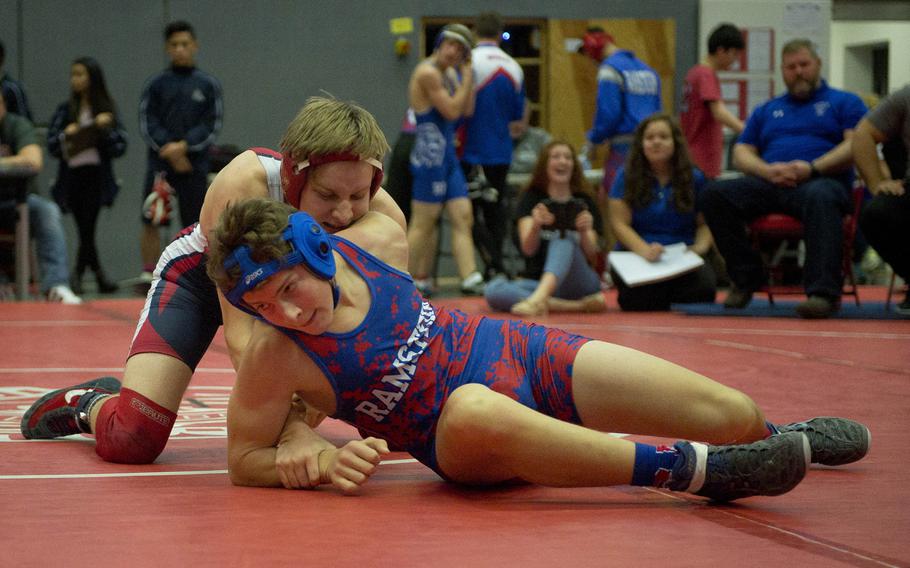 Ramstein's Russell Bodily, right, tries to get out of a hold by Spangdahlem's Tyler Hilliard during a match at Vogelweh, Germany, on Saturday, Dec. 9, 2017.