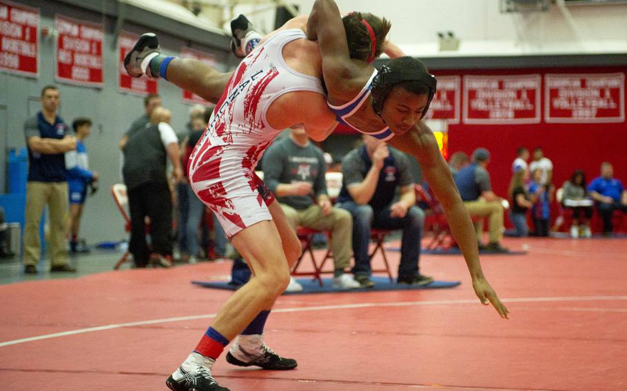 Lakenheath's Jacob Brown, left, takes Ramstein's Xavier Woodard to the mat during a match at Vogelweh, Germany, on Saturday, Dec. 9, 2017.