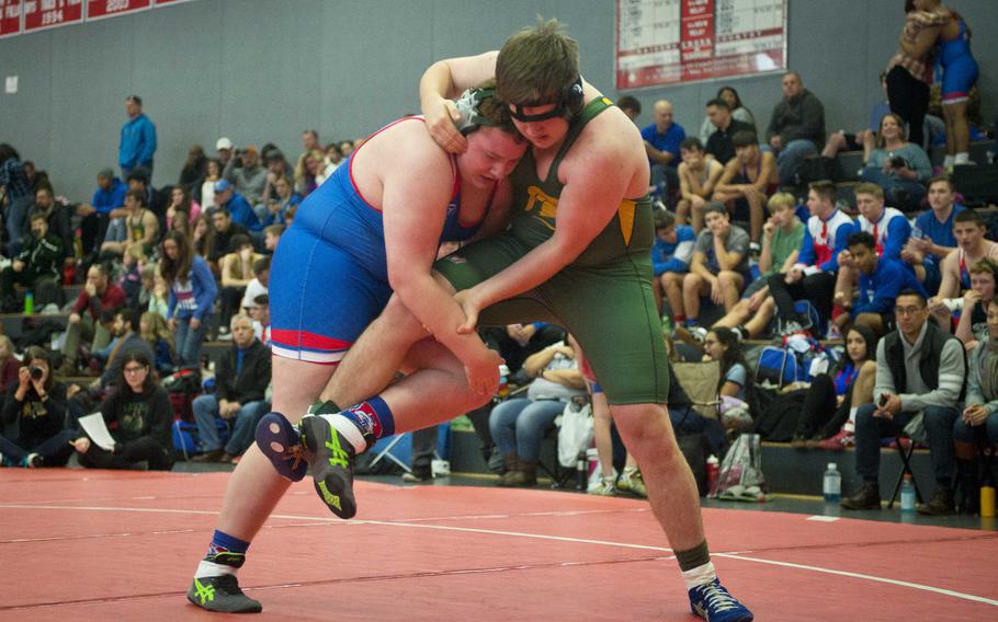 Ramstein's Ty Hoopes, left, tries to take SHAPE's Chris Davidson down during a match at Vogelweh, Germany, on Saturday, Dec. 9, 2017.