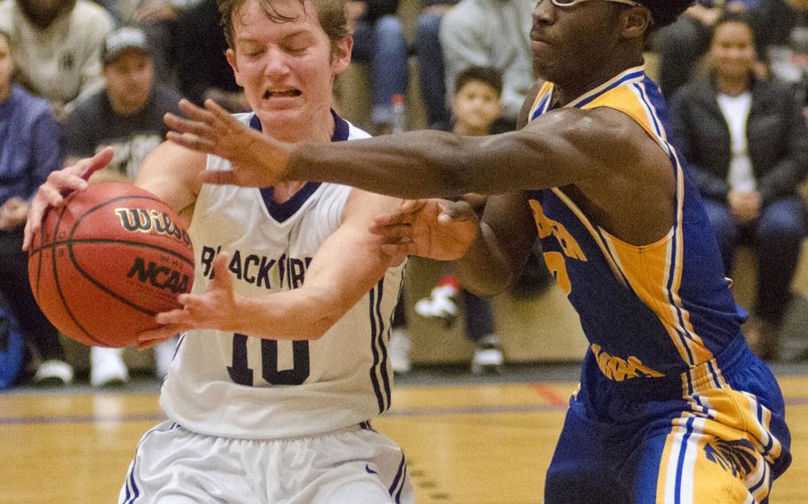 Wiesbaden's Caleb Brown defends against Black Forest Academy's Dillon Priest during a DODEA-Europe basketball game Saturday, Dec. 9, 2017 in Wiesbaden, Germany. Brown frequently used a full-court press to disrupt Priest, BFA's main ball-handler, in a 55-36 Wiesbaden win.
