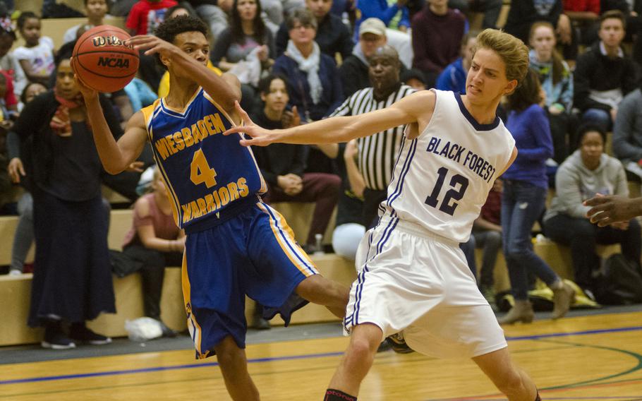 Wiesbaden's Jaylen McFadden attempts a pass against Black Forest Academy's Joseph Meeker during a DODEA-Europe basketball game Saturday, Dec. 9, 2017 in Wiesbaden, Germany. McFadden led all scorers with 16 points in his team's 55-36 win.