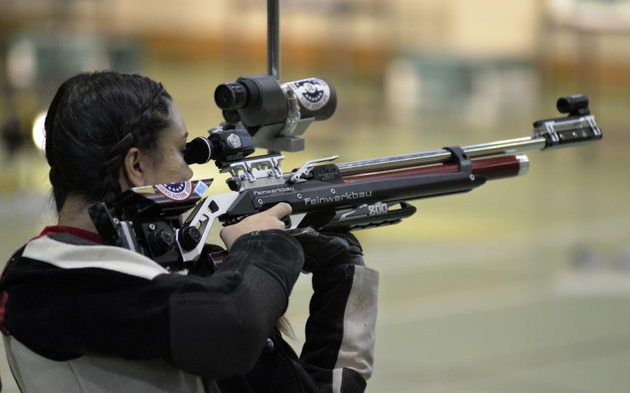 Kaiserslautern’s third-year shooter Victoria Jackson fires in her unique standing position at a 10-meter target during a high school marksmanship match at RAF Alconbury, England, Saturday, December 9, 2017. Jackson took second in the match with a combined score of 282-7.