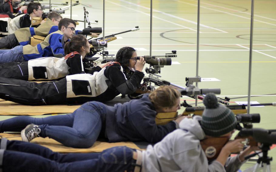 High school students from Wiesbaden, Baumholder, Spangdahlem, Kaiserslautern, SHAPE and Alconbury fire 10 shots from the prone at 10-meter targets in the first western conference marksmanship match at RAF Alconbury, England, Saturday, December 9, 2017. Kaiserslautern won the match with a team score of 1,102.