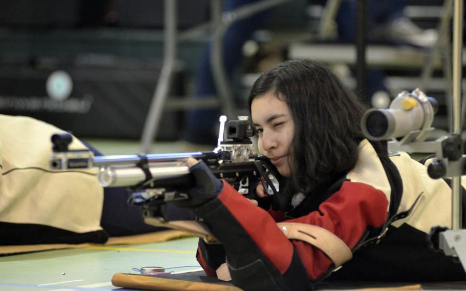 Baumholder’s Andrea Santa prepares to fire 10 shots at 10-meter targets in the prone during the first western conference high school marksmanship match at RAF Alconbury, England, Saturday, December 09, 2017. Santa earned 87 in the prone, 78 standing and 85 in the kneeling positon for a combined score of 250.