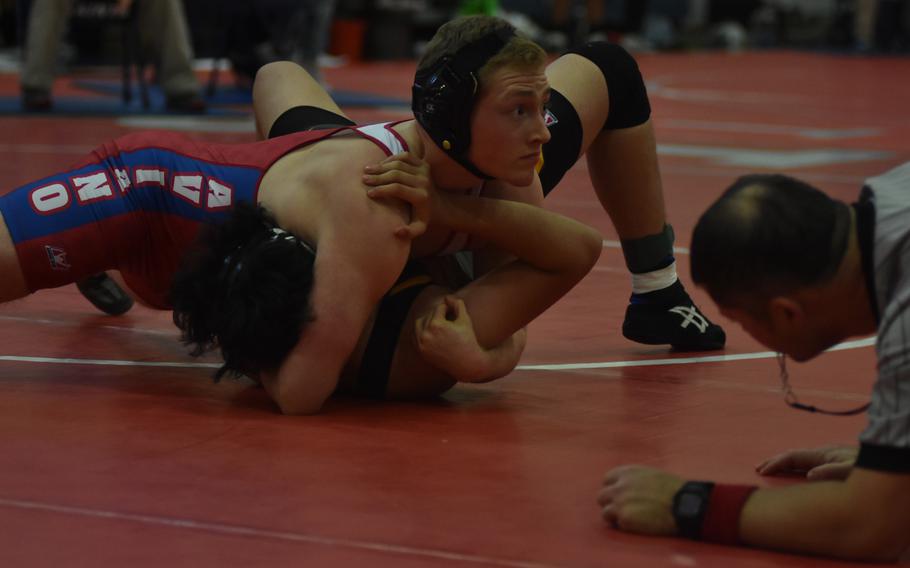 Aviano's Aiden Capps put Vicenza's Louie Torres on his back on Saturday before pinning him at 182 pounds.