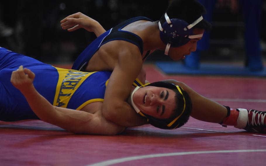 Rota's Phillip Rivera puts Sigonella's Ben Latimer in an uncomfortable position in a 120-pound match Saturday at Aviano Air Base, Italy.