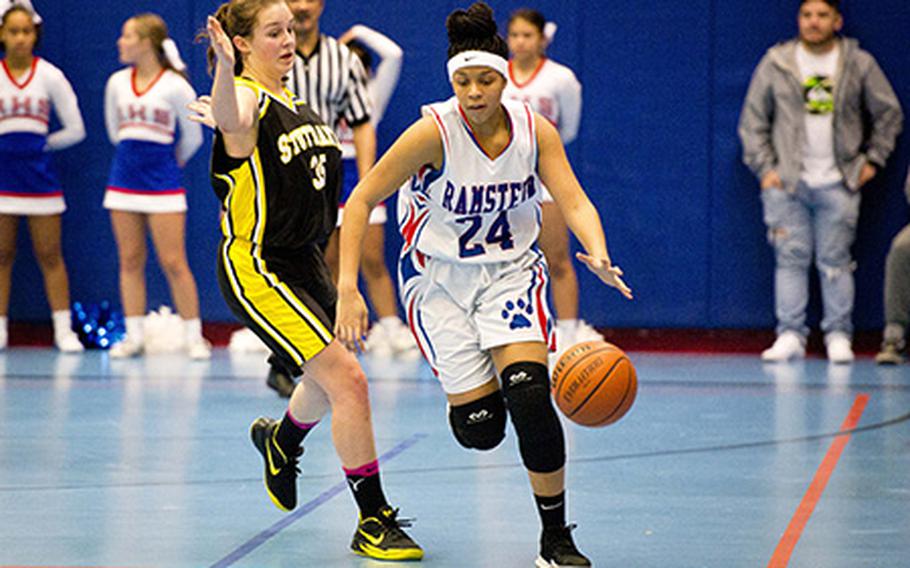 Ramstein's Shemilia Johnson, right, dribbles past Stuttgart's Claire Troiano at Ramstein Air Base, Germany, on Friday, Jan. 12, 2018.